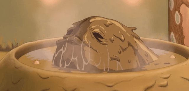 The stink spirit from Spirited away, aka a muddy blob with dark eye sockets sitting in a muddy round tub.