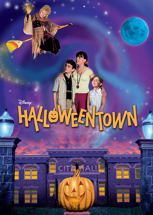 Poster from the Halloweentown movie with a purple City Hall building with a giant grinning jack-o'-lantern in front, the three sibling main characters standing above the title staring up at their grandmother who's flying on a broom above them.